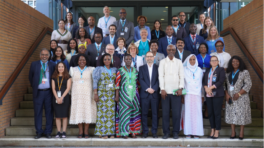 Delegates and distinguished speakers gather for a group photo during G-CAP in Bonn, Germany