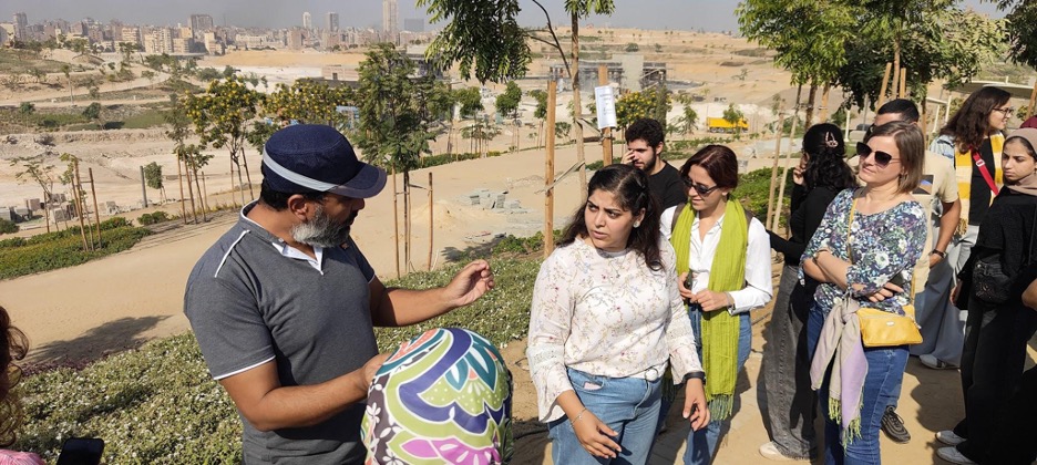 A university professor with workshop participants at a garden, in Al-Fustat, in Cairo, Egypt