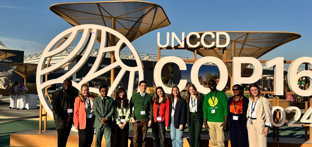 YECO participants in front of COP16 sign