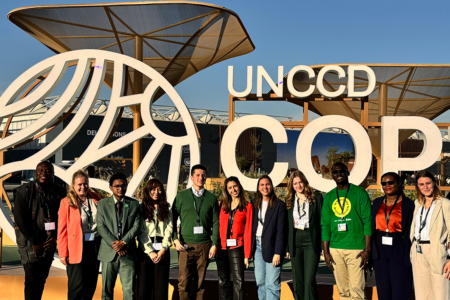 YECO participants in front of COP16 sign