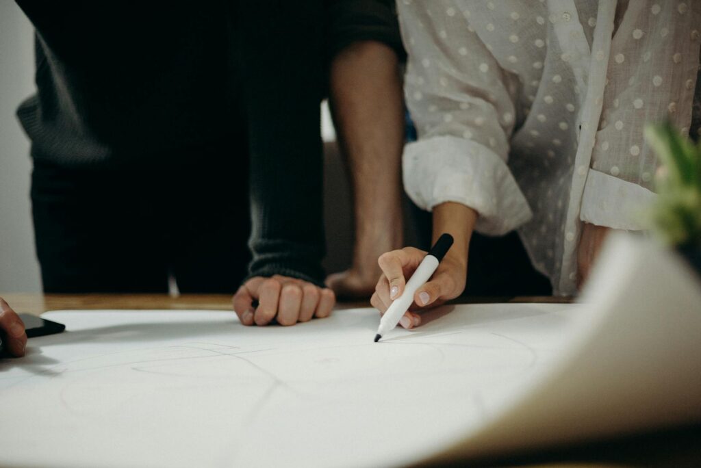 Two people study on paper
