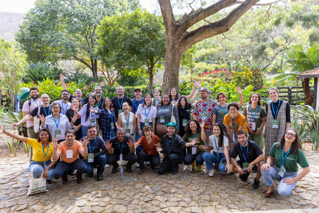 Group of training participants waving hands at the end of training