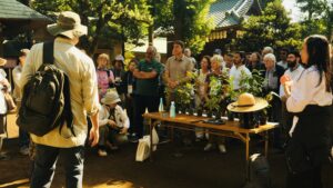 Group of participants at a Miyawaki Forest Symposium in a garden